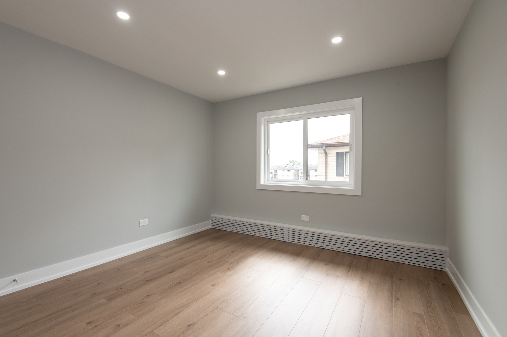 5159 North East River Road, Unit 312 Chicago, IL 60656 - Photo 29 of 42 an empty room with wooden floor and windows