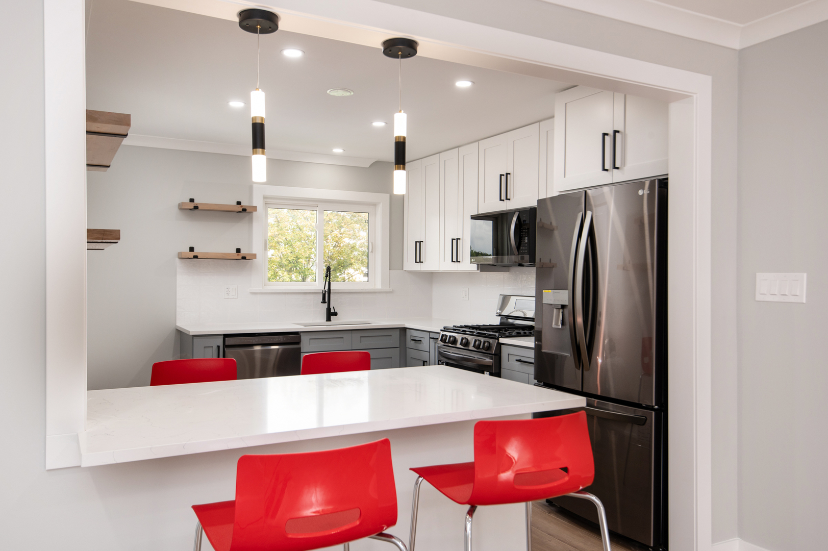 5159 North East River Road, Unit 312 Chicago, IL 60656 - Photo 3 of 42 a kitchen with stainless steel appliances granite countertop a refrigerator and a stove