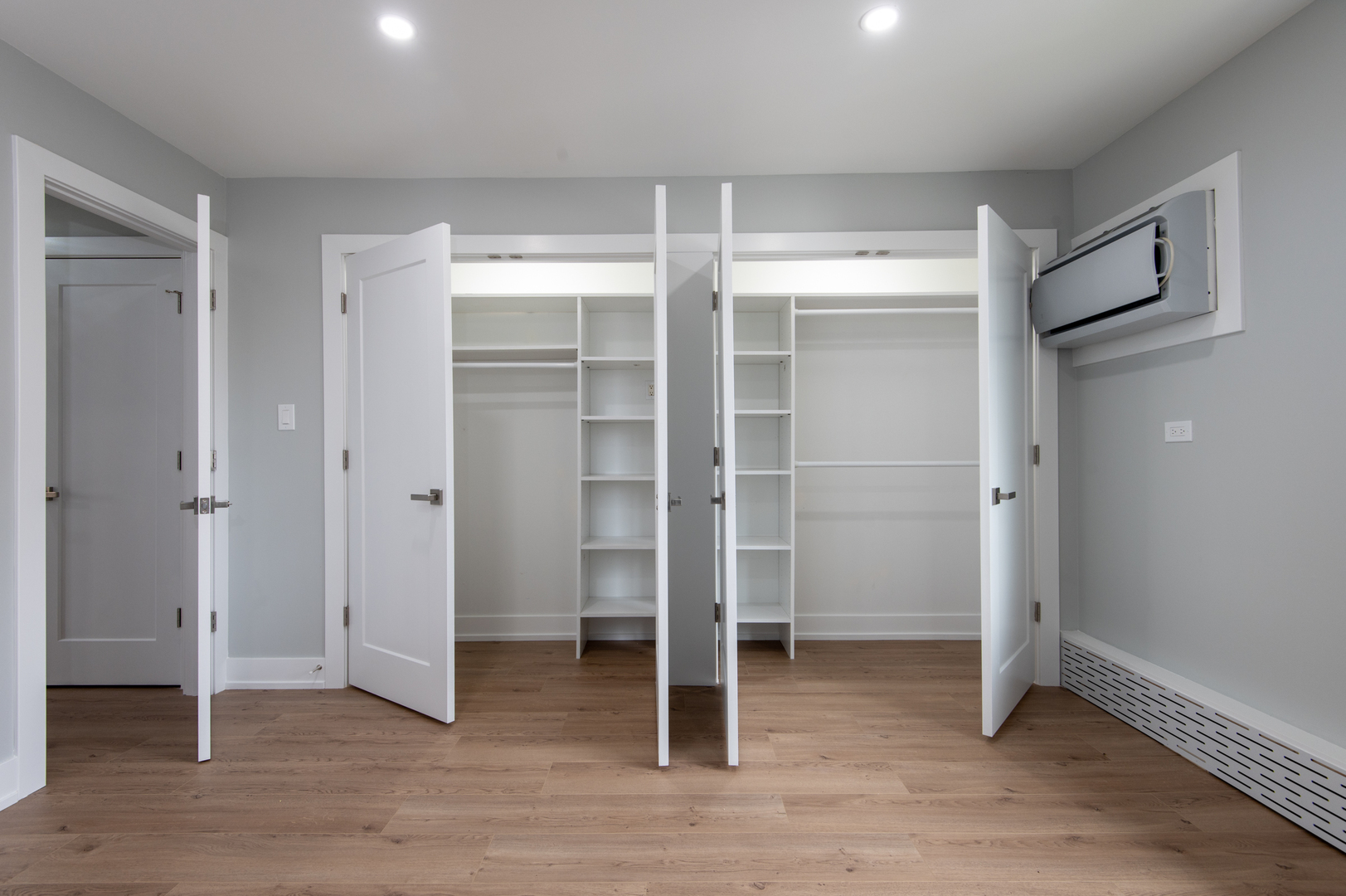 5159 North East River Road, Unit 312 Chicago, IL 60656 - Photo 31 of 42 a view of an empty room with wooden floor and closet