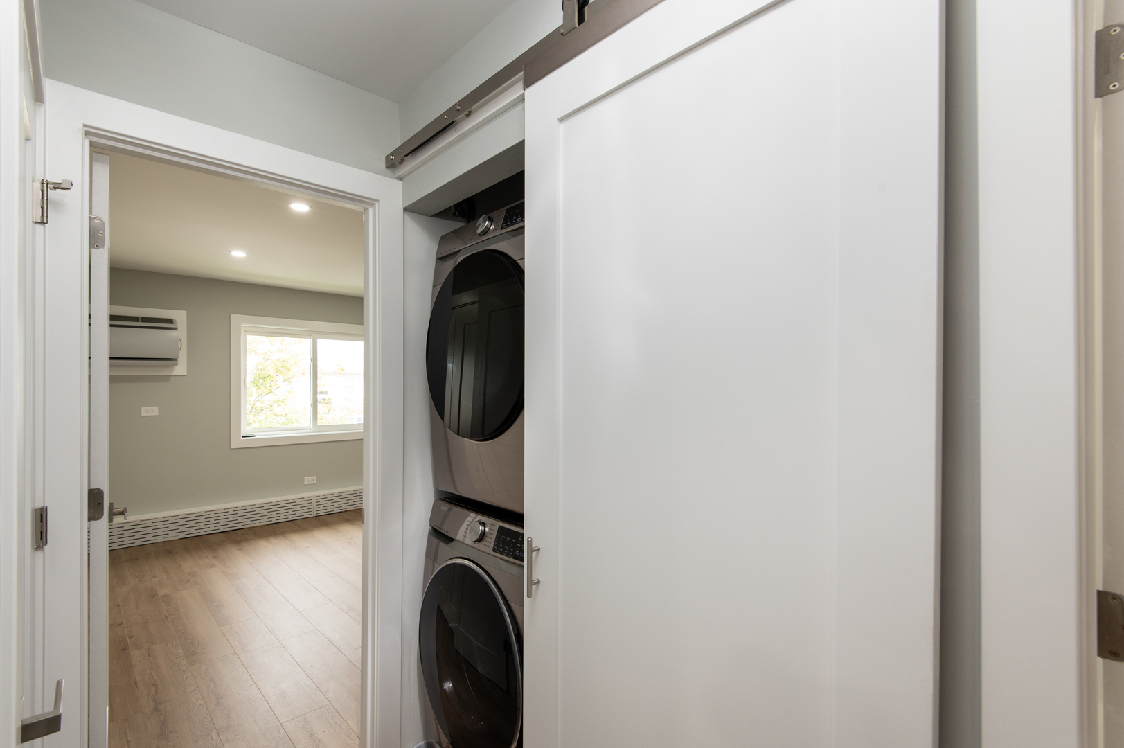 5159 North East River Road, Unit 312 Chicago, IL 60656 - Photo 32 of 42 a view of a hallway with washer and dryer