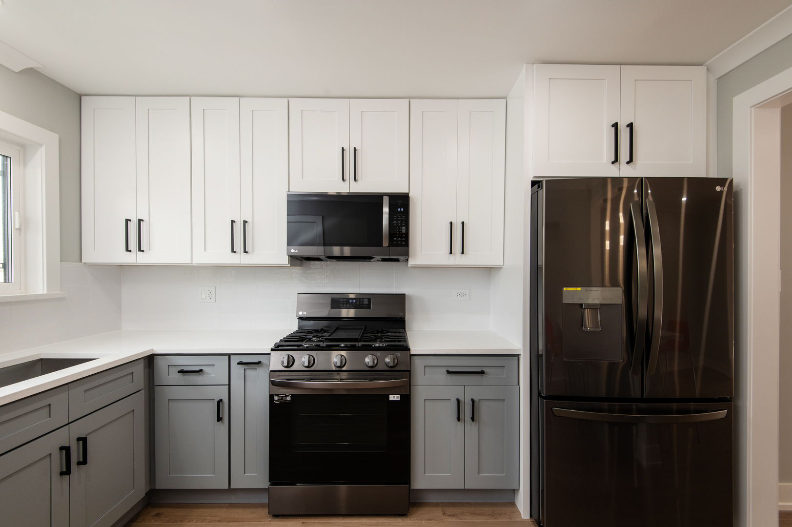 5159 North East River Road, Unit 312 Chicago, IL 60656 - Photo 5 of 42 a kitchen with stainless steel appliances and refrigerator