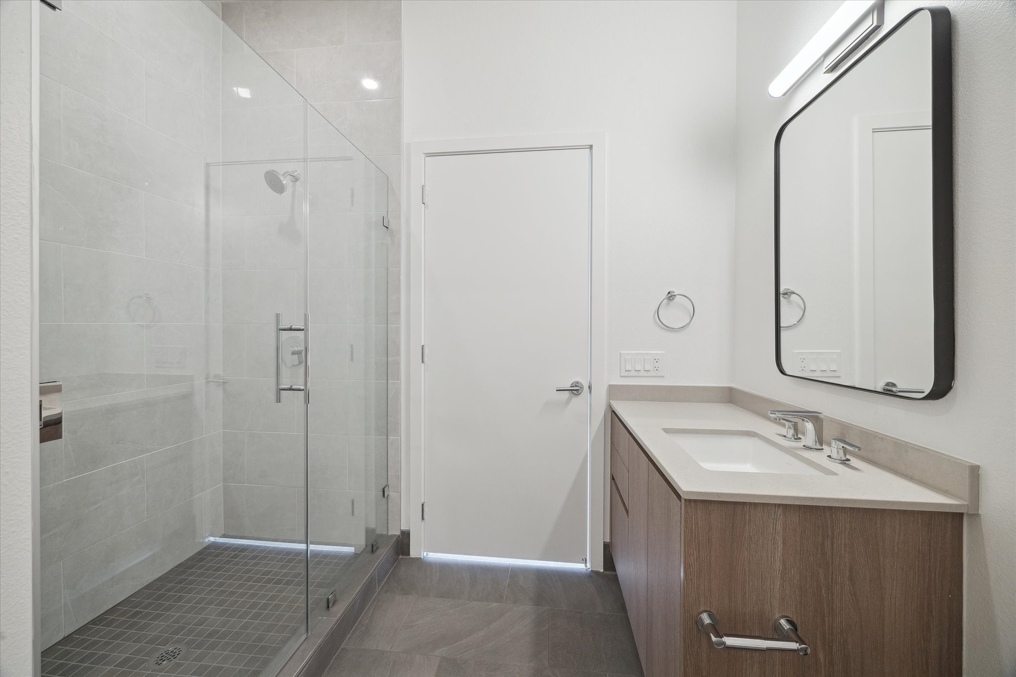 1 Riva Row, Unit 165 The Woodlands, TX 77380 - Photo 12 of 45 a bathroom with a sink and a mirror