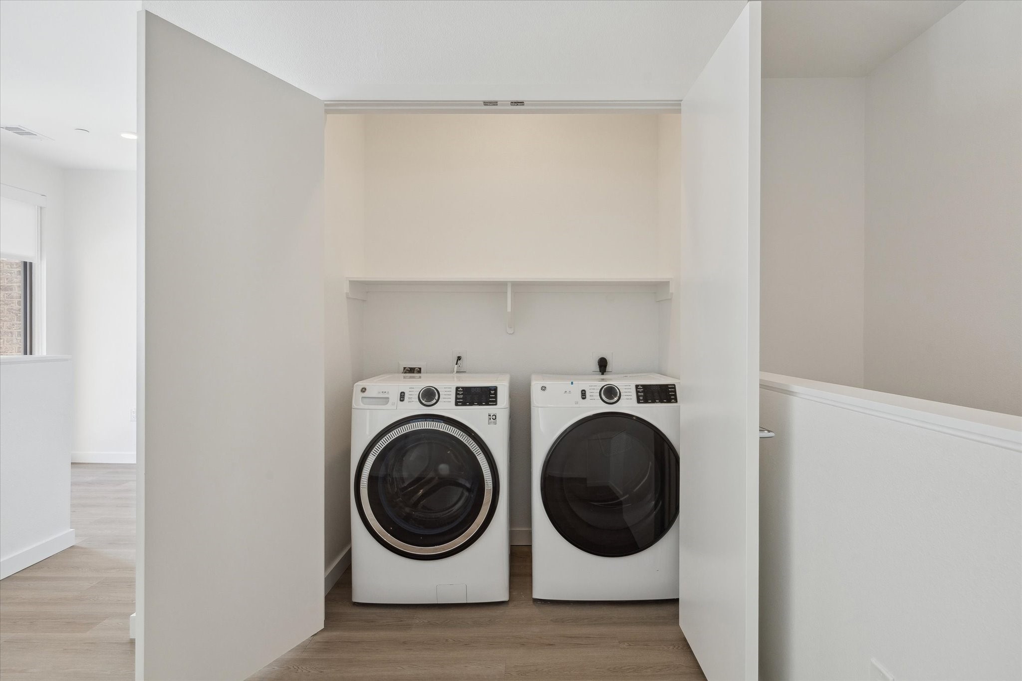 1 Riva Row, Unit 165 The Woodlands, TX 77380 - Photo 19 of 45 a utility room with dryer and washer