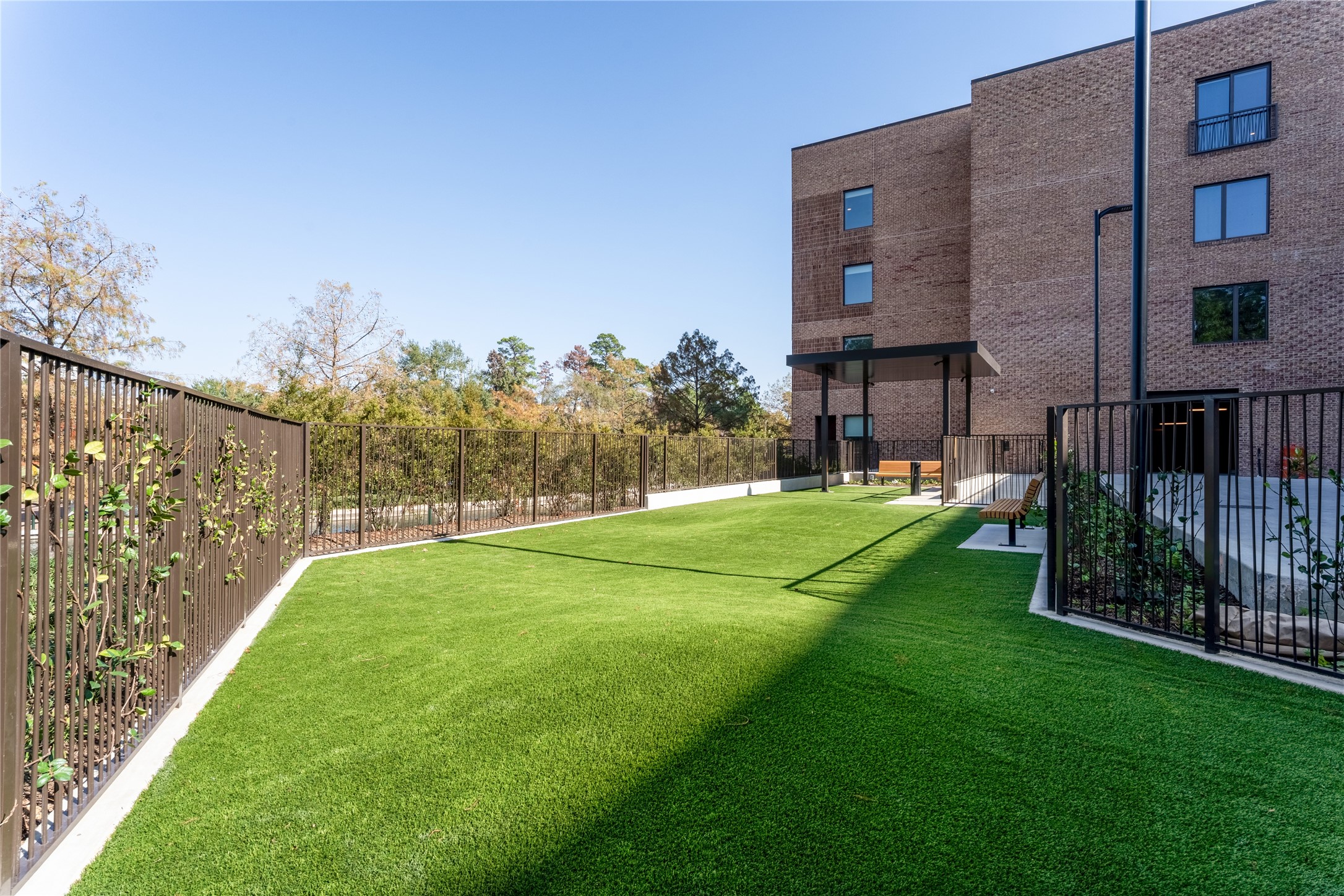 1 Riva Row, Unit 165 The Woodlands, TX 77380 - Photo 28 of 45 a view of a back yard
