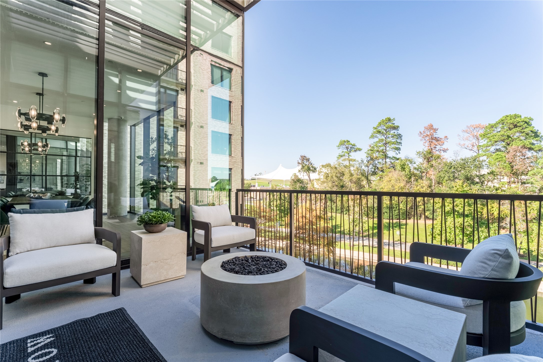 1 Riva Row, Unit 165 The Woodlands, TX 77380 - Photo 43 of 45 a balcony with furniture and a potted plant
