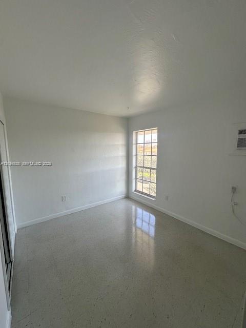 1400 Douglas Road, Unit 14 Coral Gables, FL 33134 - Photo 10 of 19 an empty room with windows