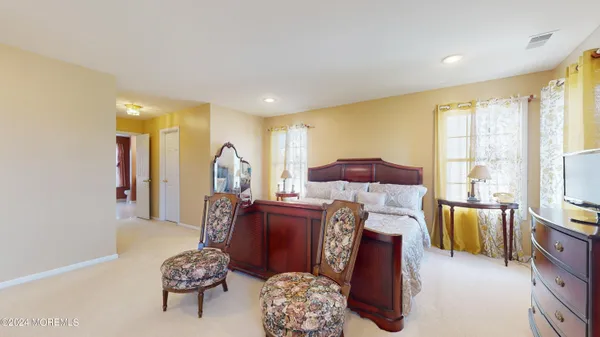 a living room with furniture fireplace and a flat screen tv