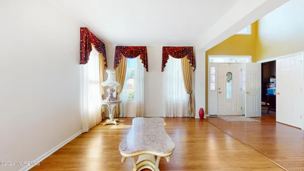 a view of a room with gym equipment and a window