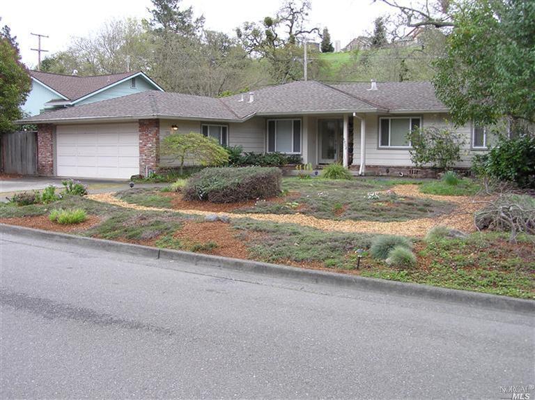 5802 Monte Verde Drive Santa Rosa, CA 95409 - Photo 1 of 1 a front view of a house with a yard and potted plants
