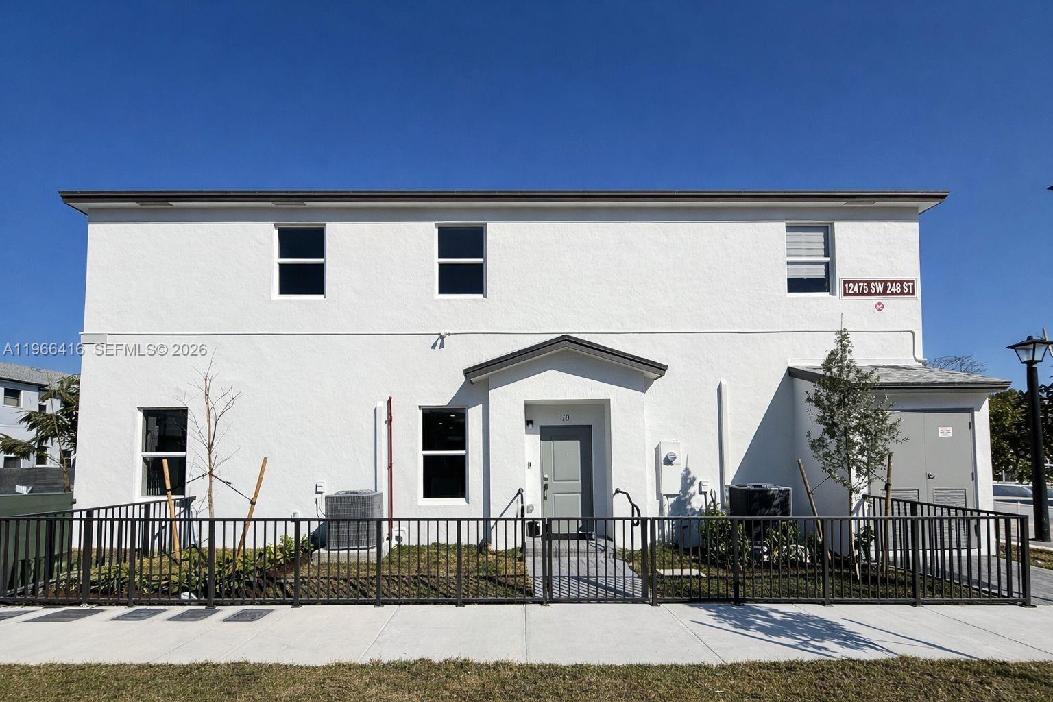 front view of a house with a street