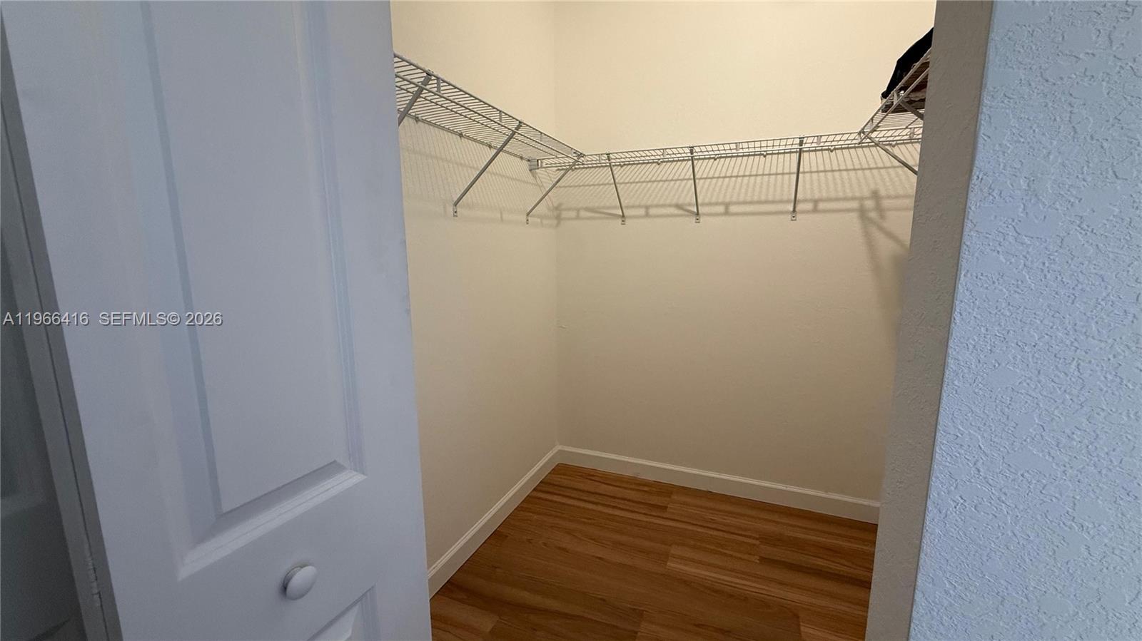 12420 Southwest 248th Street, Unit 10 Homestead, FL 33032 - Photo 11 of 16 a view of a room with racks on the wall