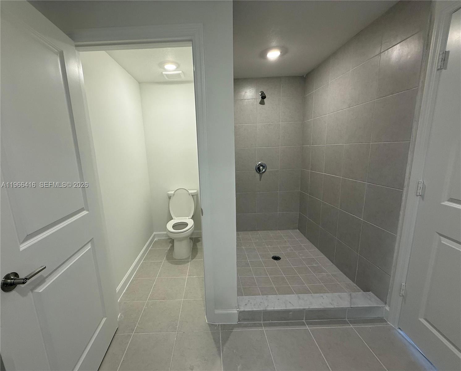 12420 Southwest 248th Street, Unit 10 Homestead, FL 33032 - Photo 14 of 16 a bathroom with a shower and a toilet