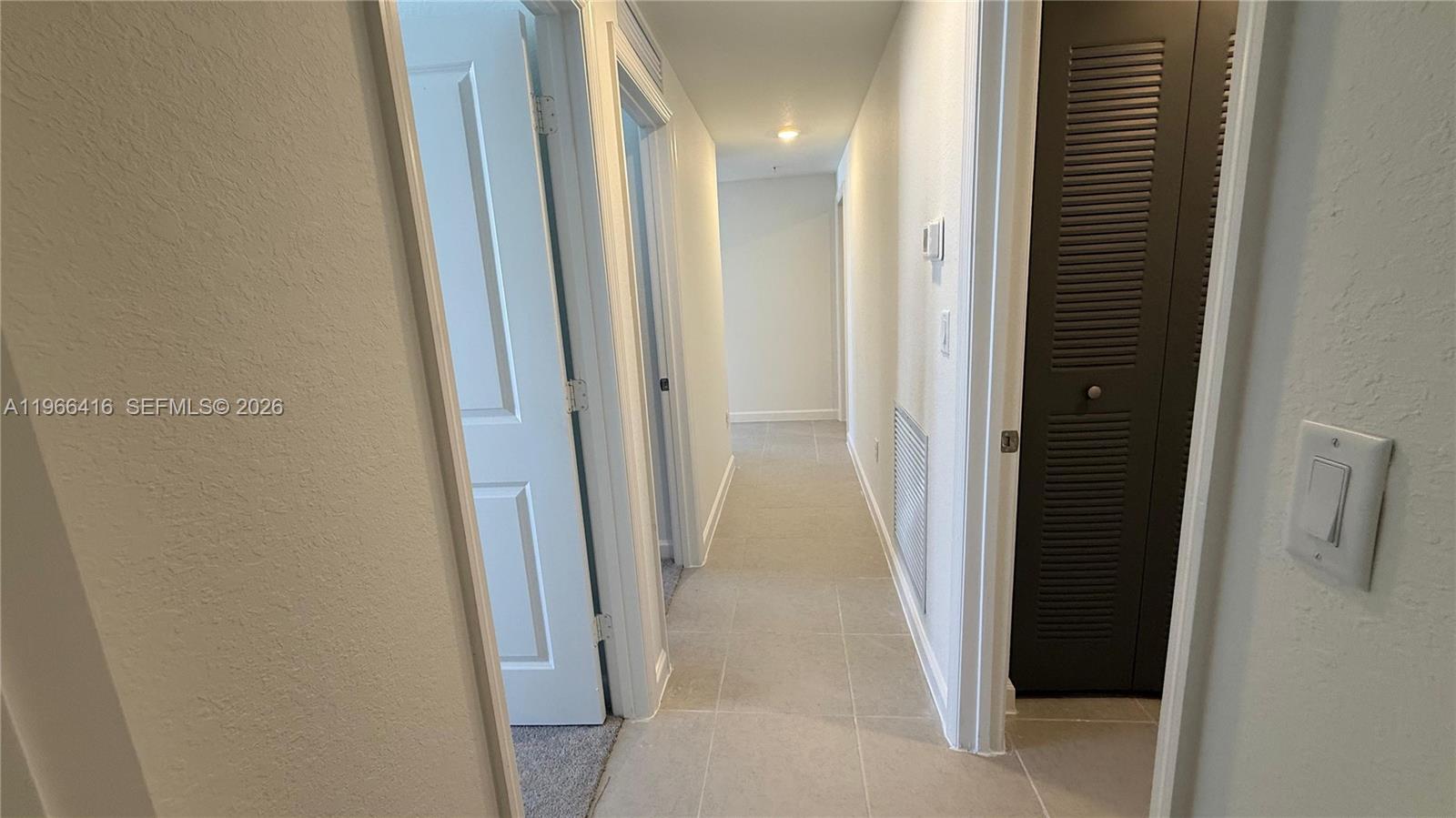 12420 Southwest 248th Street, Unit 10 Homestead, FL 33032 - Photo 8 of 16 a view of a hallway