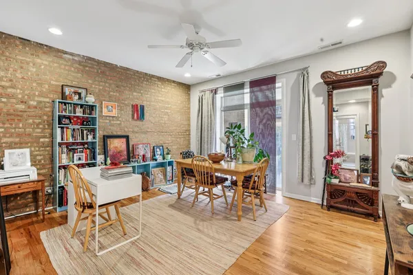 a view of a dining room with furniture window and wooden floor
