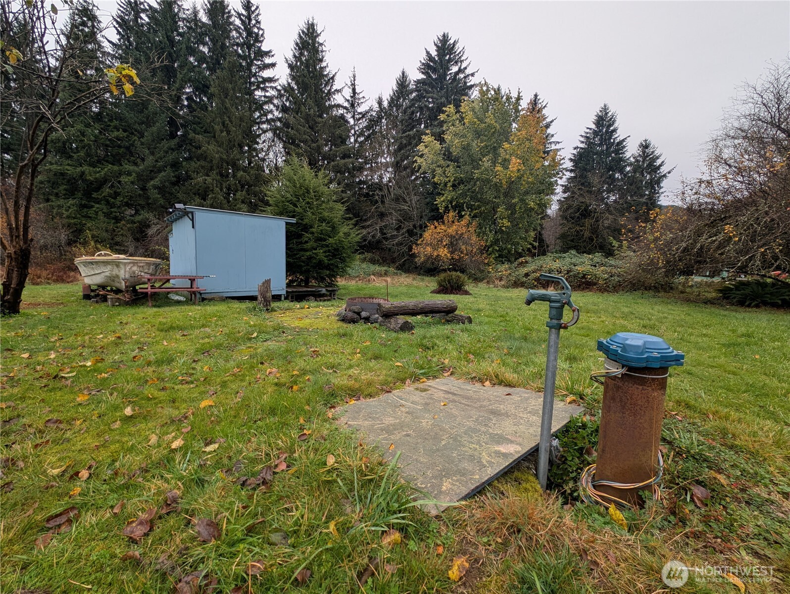 a view of a backyard with sitting area