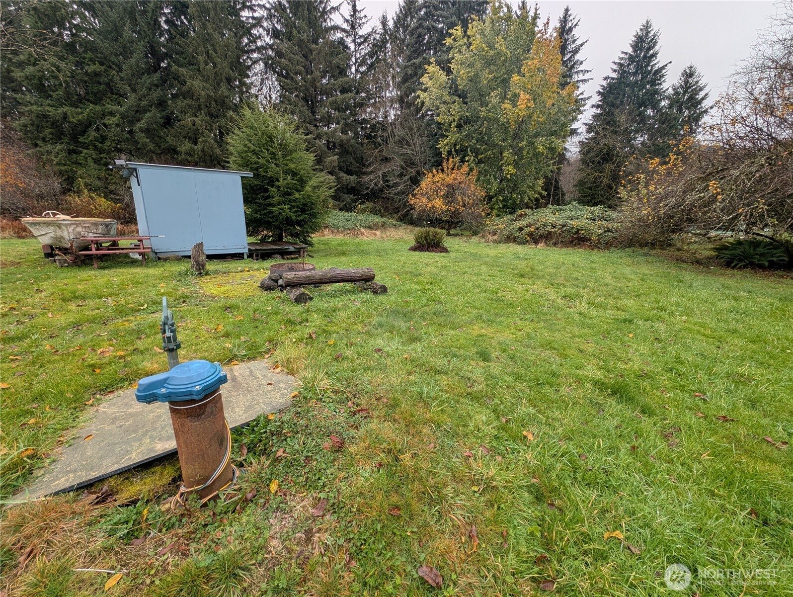 81 Barber Road Clallam Bay, WA 98326 - Photo 4 of 30 a view of a water fountain and a bench in the background