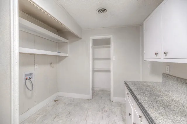 a view of a kitchen cabinets a sink and dishwasher in a kitchen