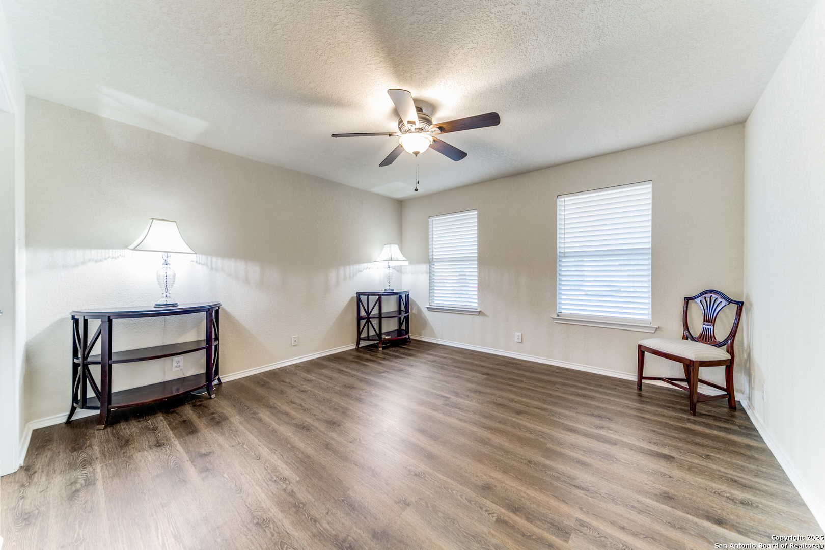 133 Hampton Cove Boerne, TX 78006 - Photo 14 of 24 a view of livingroom with furniture chandelier fan and windows