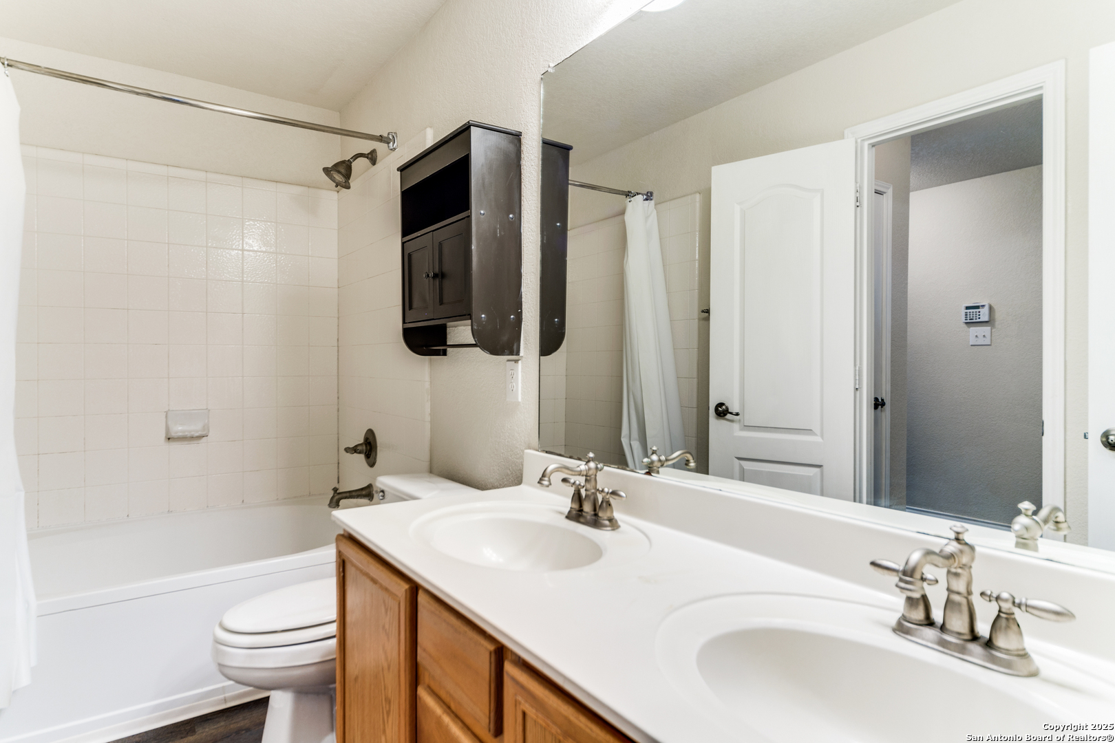 133 Hampton Cove Boerne, TX 78006 - Photo 20 of 24 a bathroom with a sink a toilet and shower