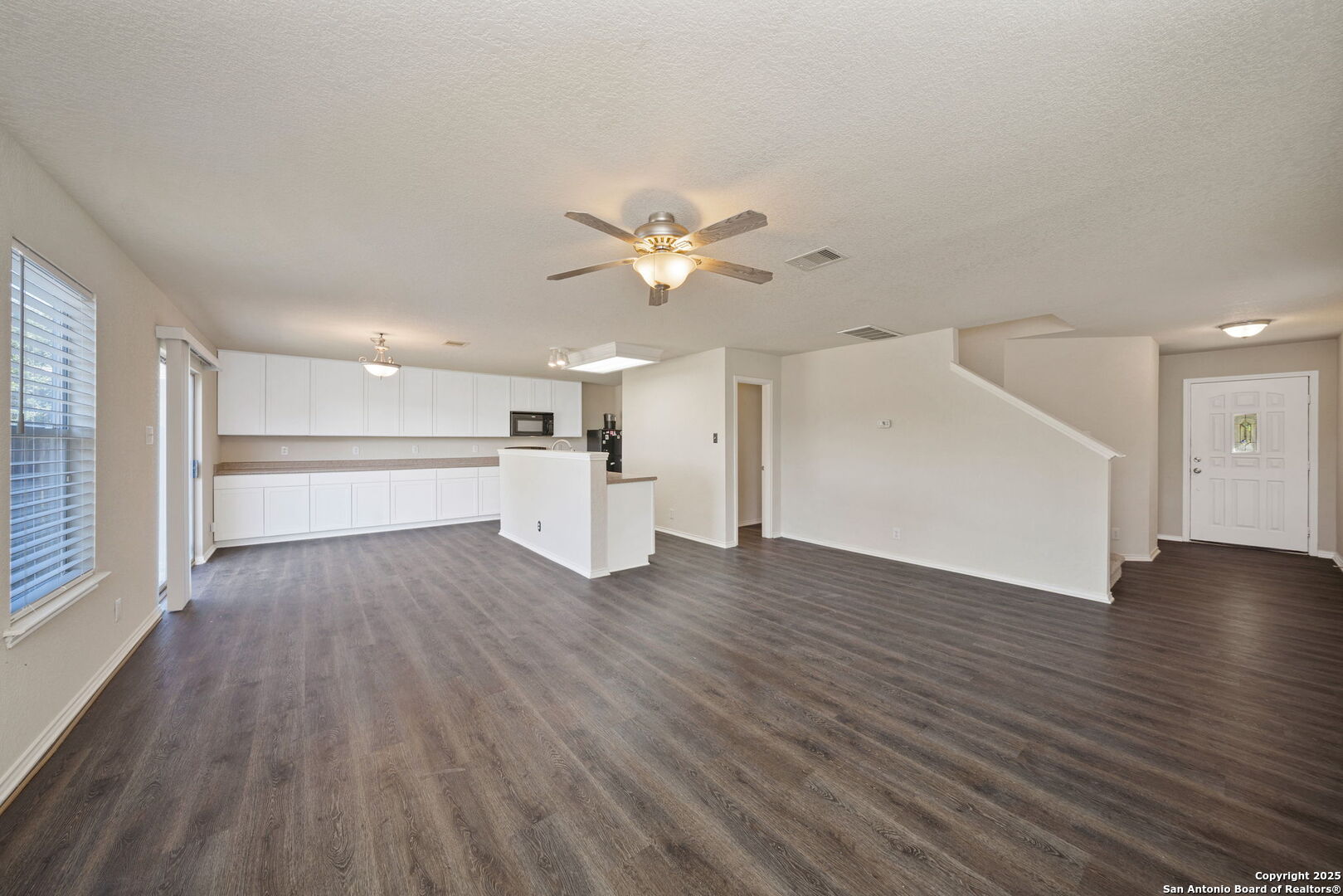 133 Hampton Cove Boerne, TX 78006 - Photo 3 of 24 a view of empty room with wooden floor and window