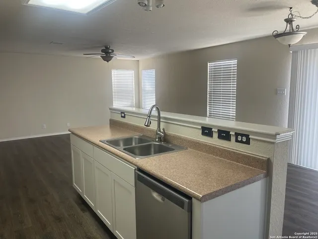a kitchen that has a sink and a window
