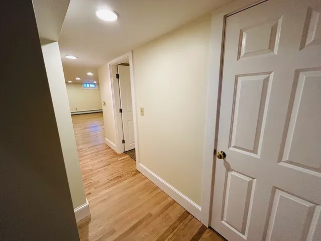 a bathroom with a granite countertop toilet and a shower