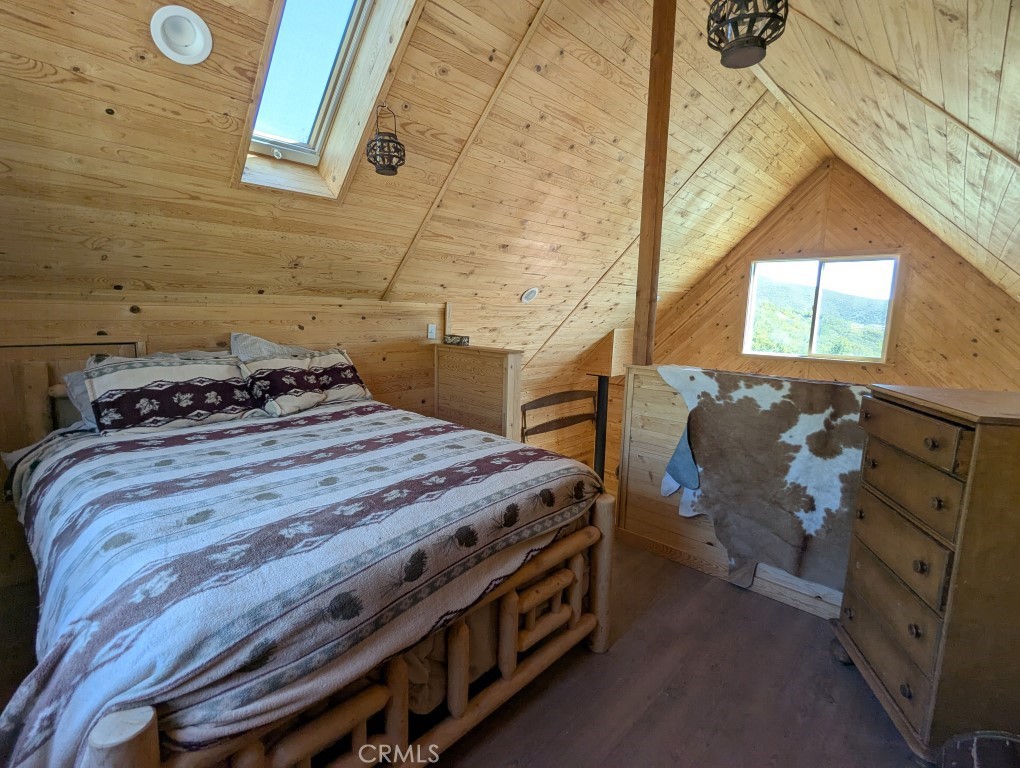 0 Toomes Camp Road Red Bluff, CA 96080 - Photo 15 of 26 a bed sitting in a bedroom next to a window