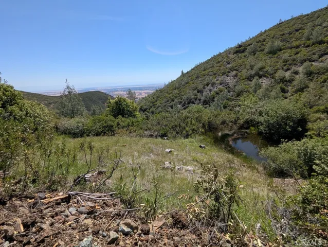 a view of a large mountains with a mountain in the background