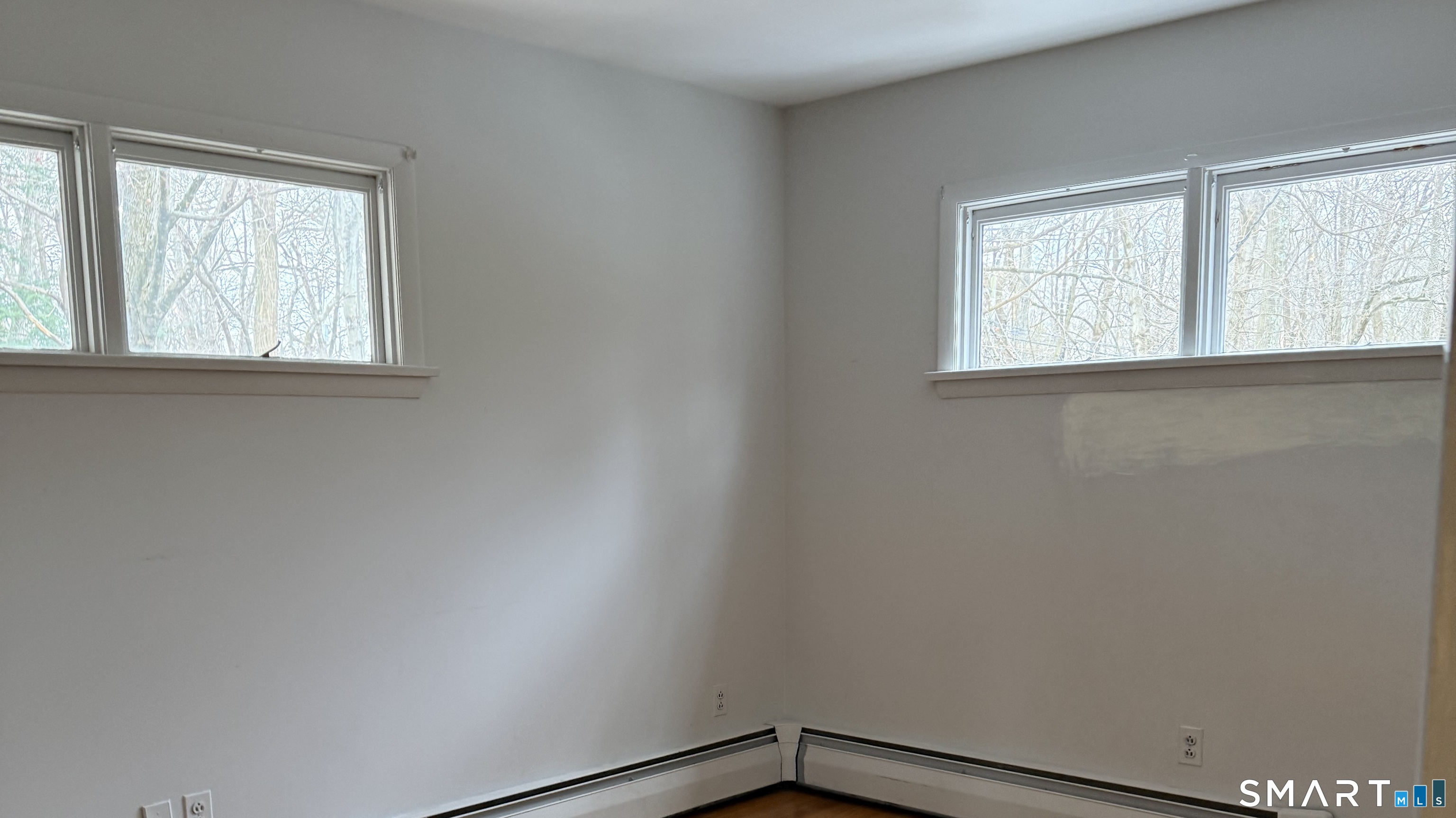 146 Scribner Hill Road Wilton, CT 06897 - Photo 6 of 13 an empty room with a window