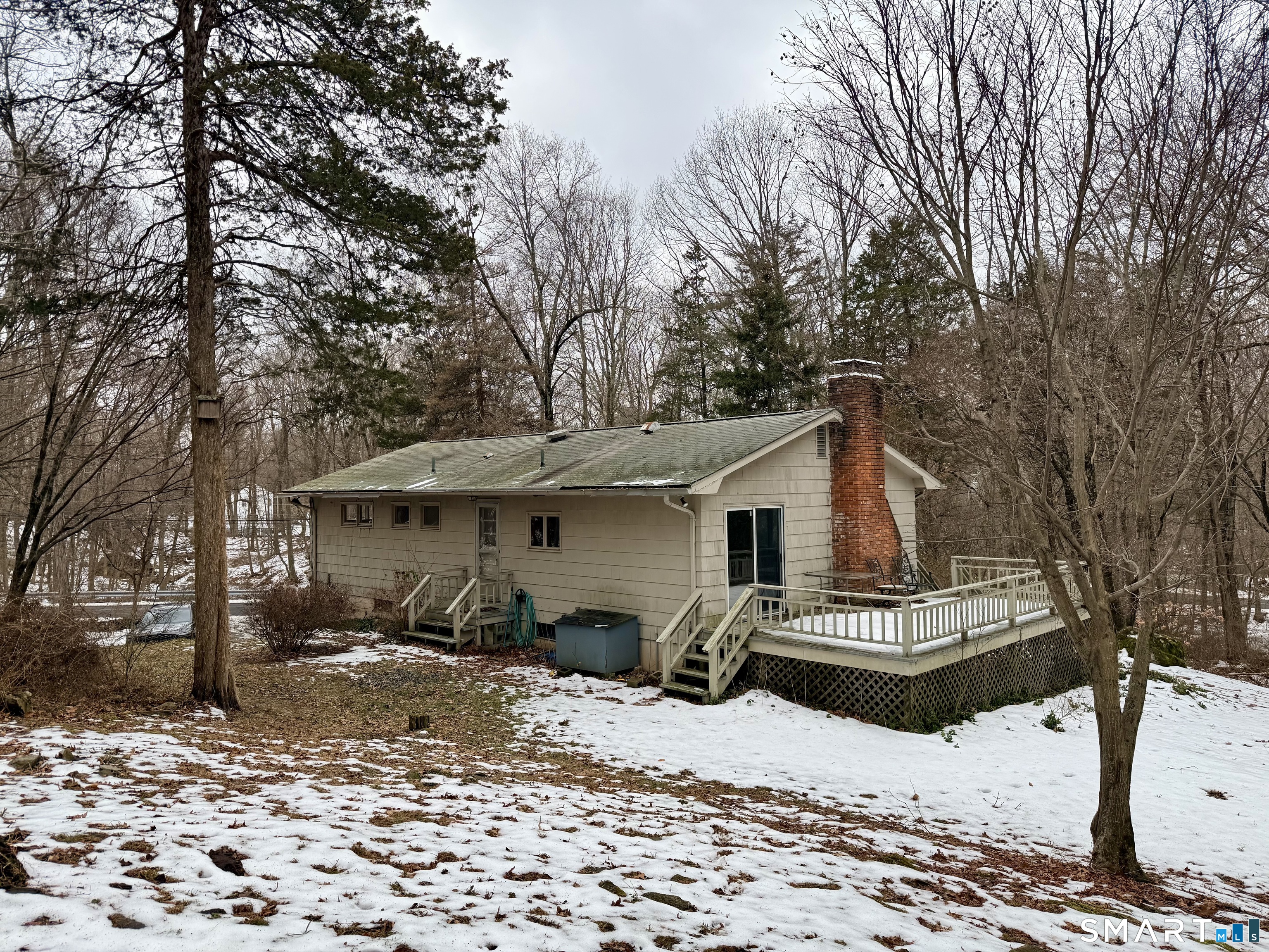 146 Scribner Hill Road Wilton, CT 06897 - Photo 10 of 13 a view of a house covered in snow