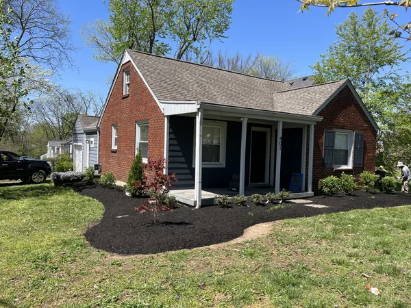 a front view of a house with a yard
