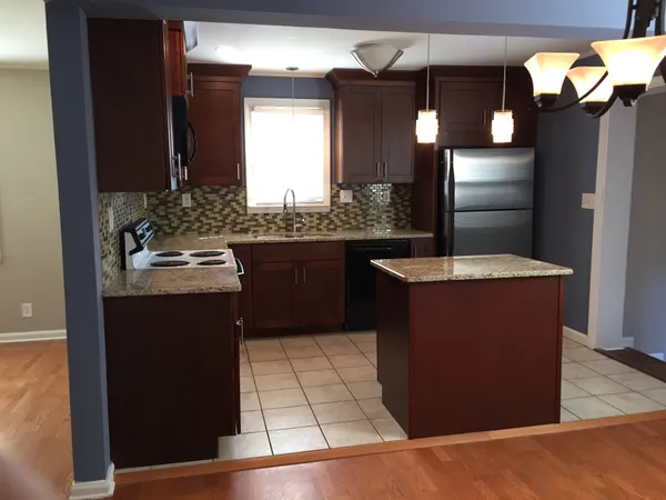 a kitchen with a sink counter top space and appliances