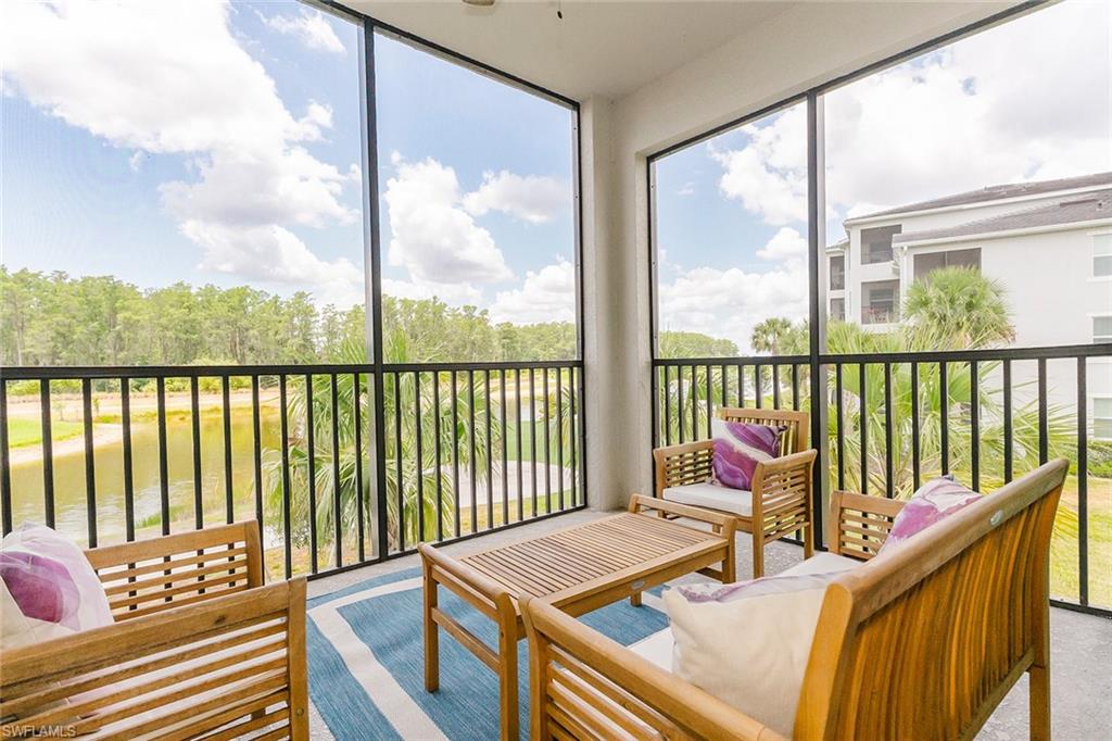 a view of balcony with wooden floor and outdoor seating