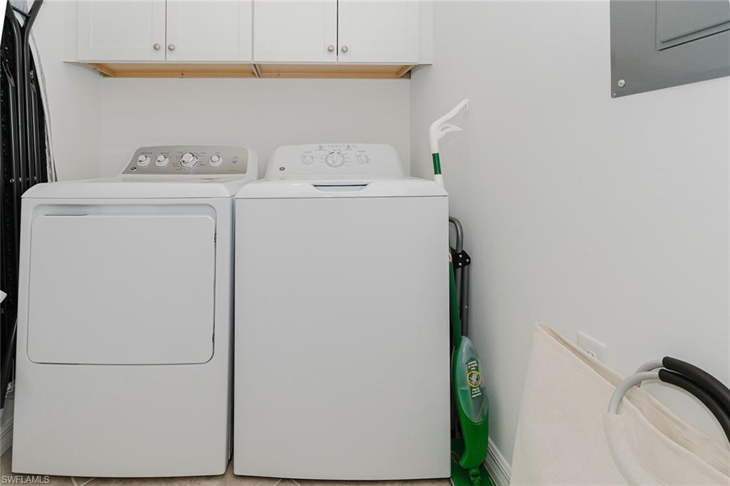 6034 National Boulevard, Unit 528 Ave Maria, FL 34142 - Photo 30 of 43 a utility room with dryer and washer