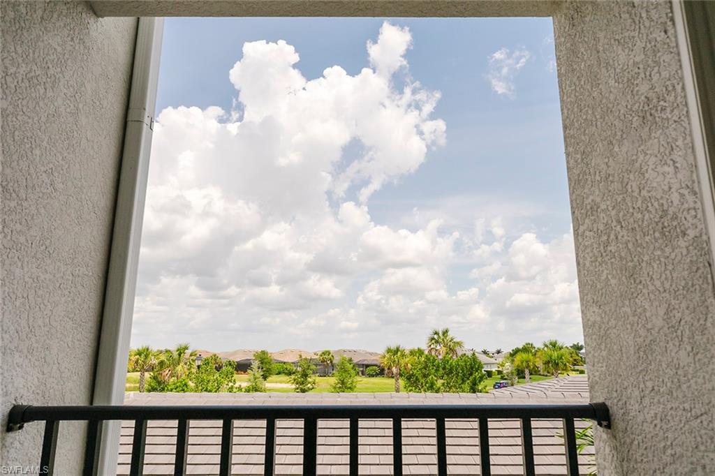 6034 National Boulevard, Unit 528 Ave Maria, FL 34142 - Photo 31 of 43 a view of a balcony with wooden floor