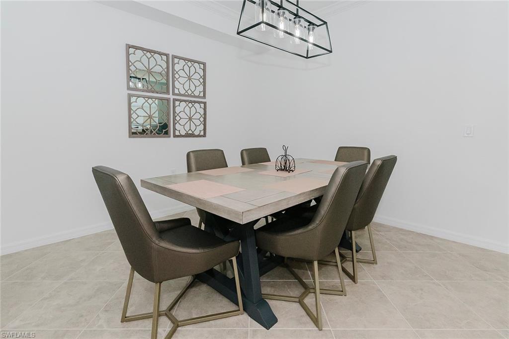 6034 National Boulevard, Unit 528 Ave Maria, FL 34142 - Photo 5 of 43 a view of a dining room with furniture