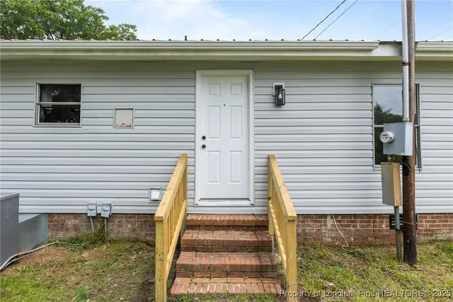 a front view of house with yard and seating area