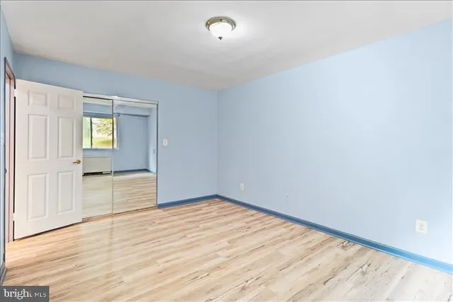 a sign broad in the middle of a park