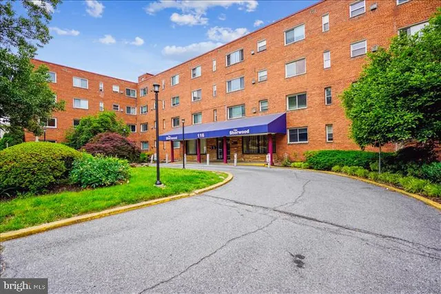 a view of a building with a yard