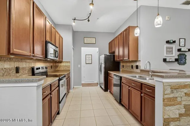 a stove top oven sitting inside of a kitchen