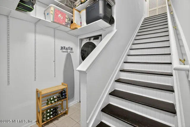 a kitchen with stainless steel appliances a stove top oven a sink a counter top space and cabinets