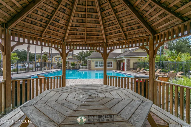 a view of a roof deck with wooden fence
