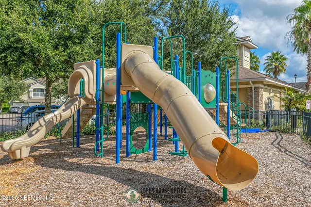 a view of outdoor space with swimming pool and seating