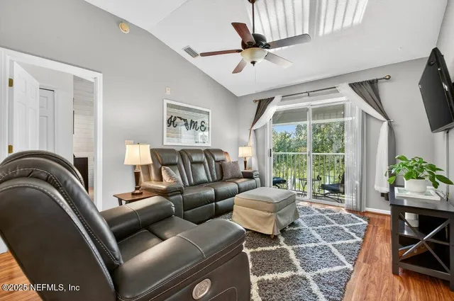 a kitchen with stainless steel appliances granite countertop a refrigerator and a stove