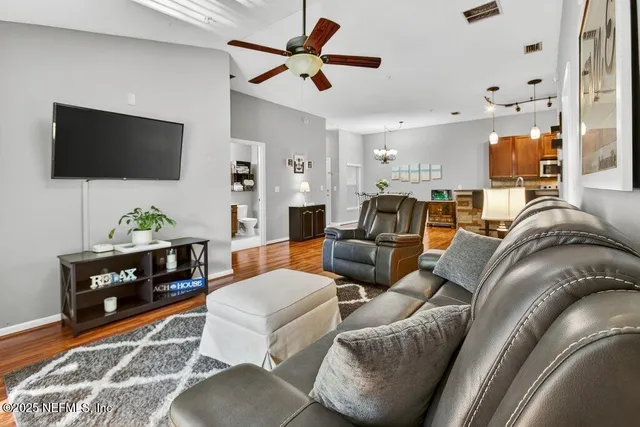 a view of a porch with a table and chairs