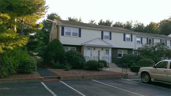 a front view of a house with garage
