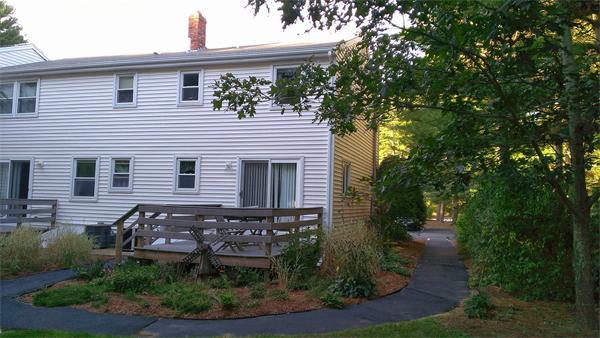 145 Burt Street, Unit 1 Norton, MA 02766 - Photo 10 of 10 a view of a house with a yard