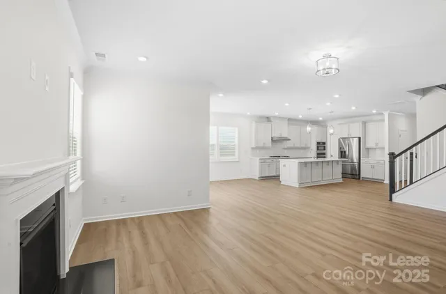 a view of kitchen with wooden floor