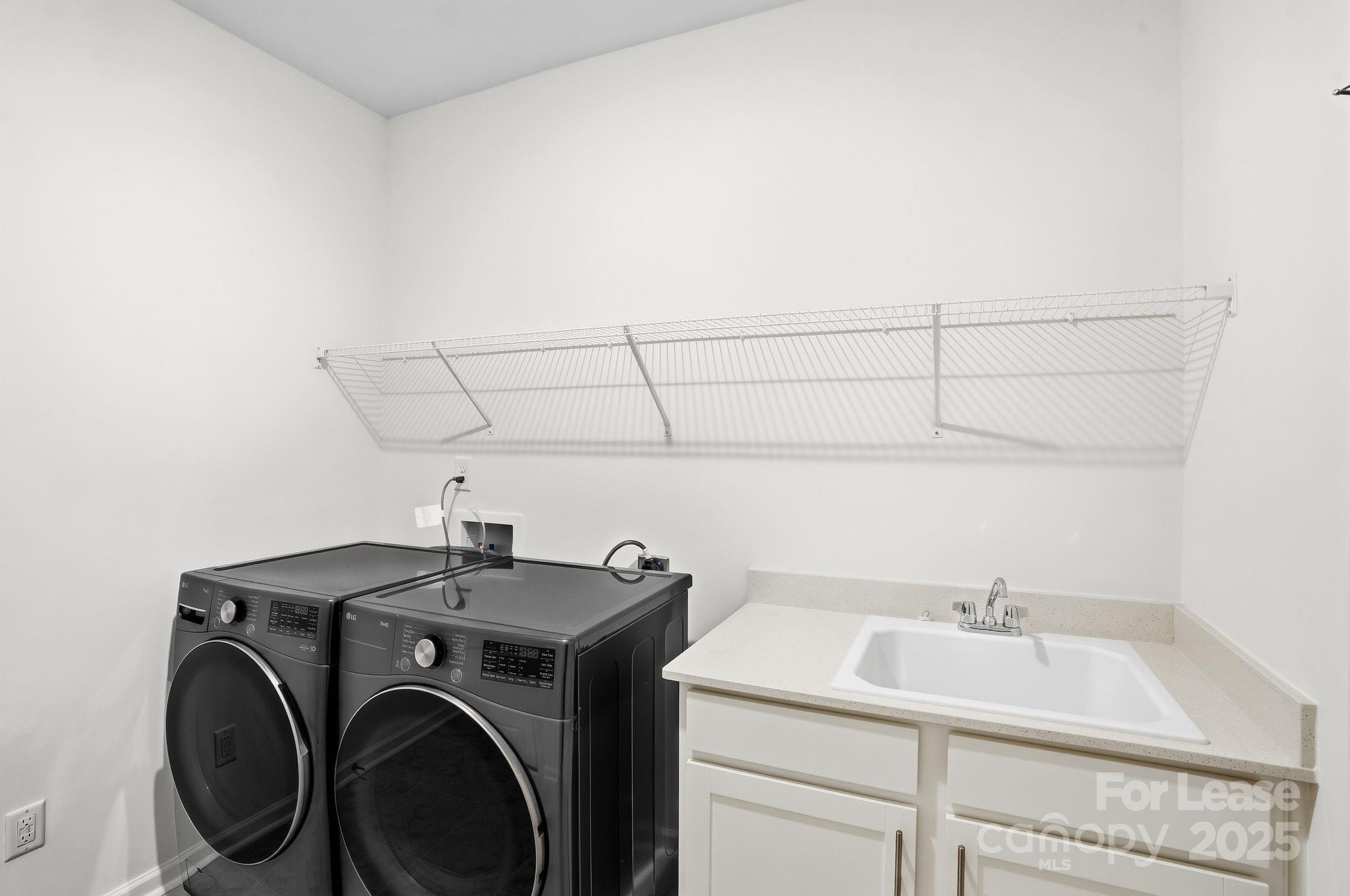 10205 Whitaker Pointe Drive Huntersville, NC 28078 - Photo 29 of 48 a utility room with dryer and washer