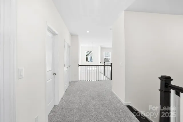 a view of a hallway with windows